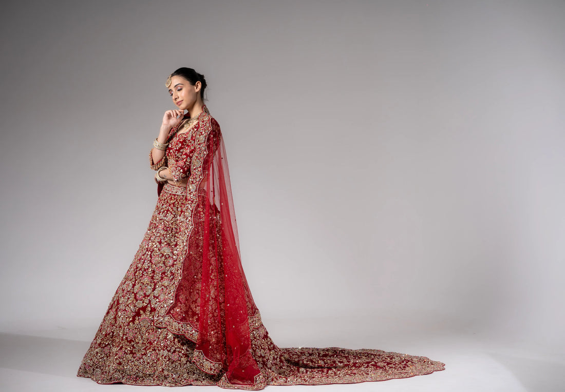 Crimson Red Heavy Zardosi Embroidered Bridal Lehenga With Royal Trail